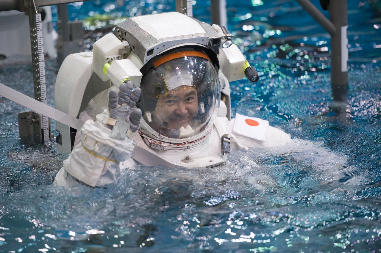 Expedition 33 crew members Sunita Williams and Aki Hoshide during NBL EVA training.  Photo Date: January 11, 2012.  Location: NBL - Pool Topside.  Photographer: Robert Markowitz