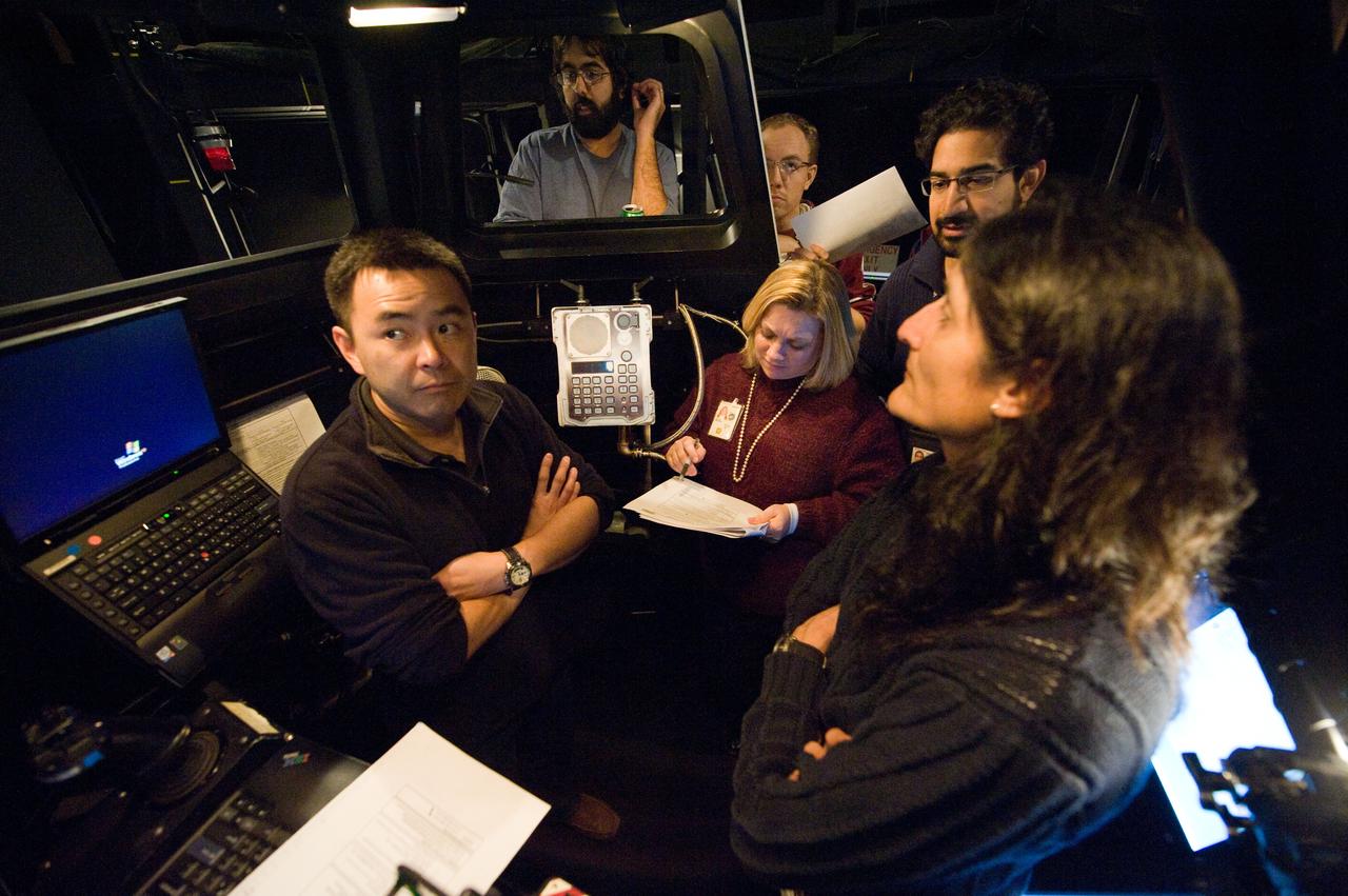 Expedition 33 crew members Suni Williams and Aki Hoshide at the SSRMS Track and Capture training station in the SES Dome.  Photo Date: January 13, 2012.  Location: Building 16, SES Dome.  Photographer: Robert Markowitz