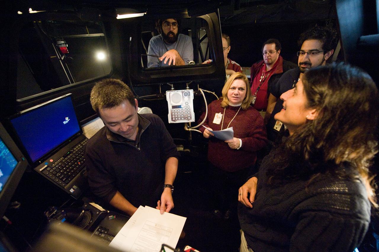 Expedition 33 crew members Suni Williams and Aki Hoshide at the SSRMS Track and Capture training station in the SES Dome.  Photo Date: January 13, 2012.  Location: Building 16, SES Dome.  Photographer: Robert Markowitz