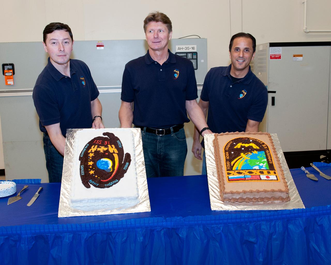 PHOTO DATE: 18 January 2012 LOCATION: Bldg. 5s, High Bay & Bldg. 9NW - ISS Mockups at SVMTF SUBJECT: Expedition 31 crew during cake cutting ceremony and Expedition 31/32 in ISS training mockup. PHOTOGRAPHER: Tom Murray - United Space Alliance