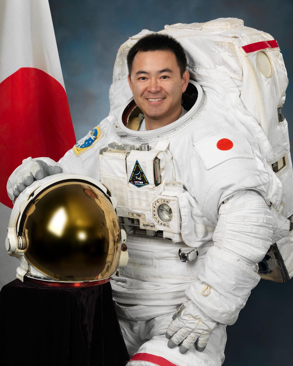 Official portrait of JAXA astronaut Aki Hoshide in an EMU.  Photo Date: January 12, 2012.  Location: Building 8, Room 183 - Photo Studio.  Photographer: Robert Markowitz