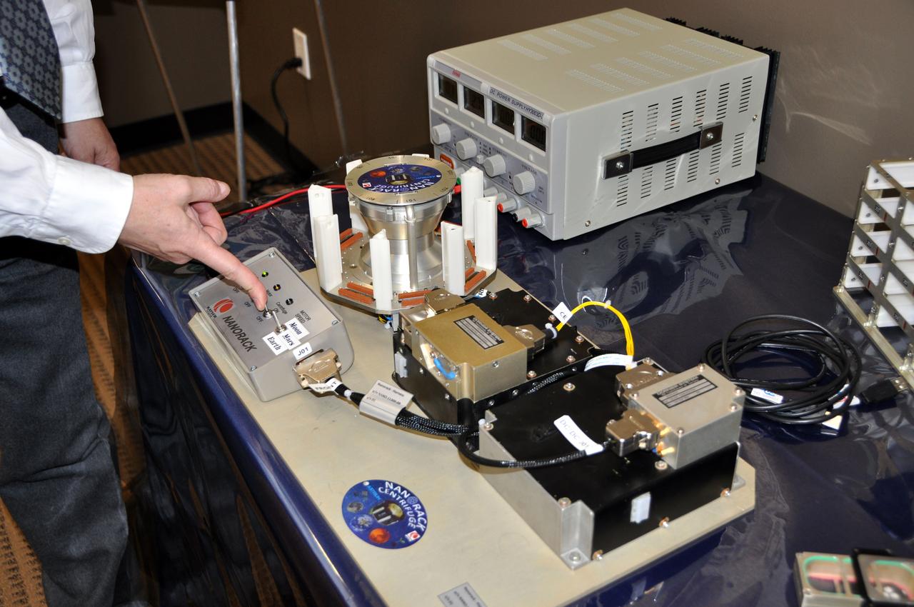 JSC2012-E-029873 (14 Feb. 2012) --- This is a medium close-up view of a gravitational research centrifuge which Astrium Space Transportation handed over to NanoRacks LLC, during a ceremony on Feb. 14 at Astrium North America?s Houston facility. Astrium ST and NanoRacks are working in cooperation with NASA to deliver the commercial centrifuge facility to the International Space Station. NASA Photo courtesy Astrium North America