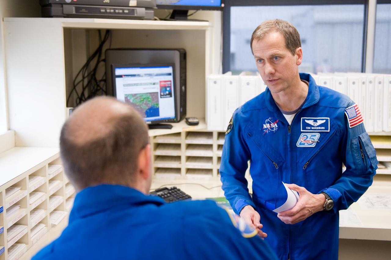 Date: 03-09-12 Location: Ellington Field Subject: Expedition 35 (Soyuz 33S) crew member Tom Marshburn preparing for his T-38 fligh with NASA pilot Thomas Parent. Photographer: James Blair