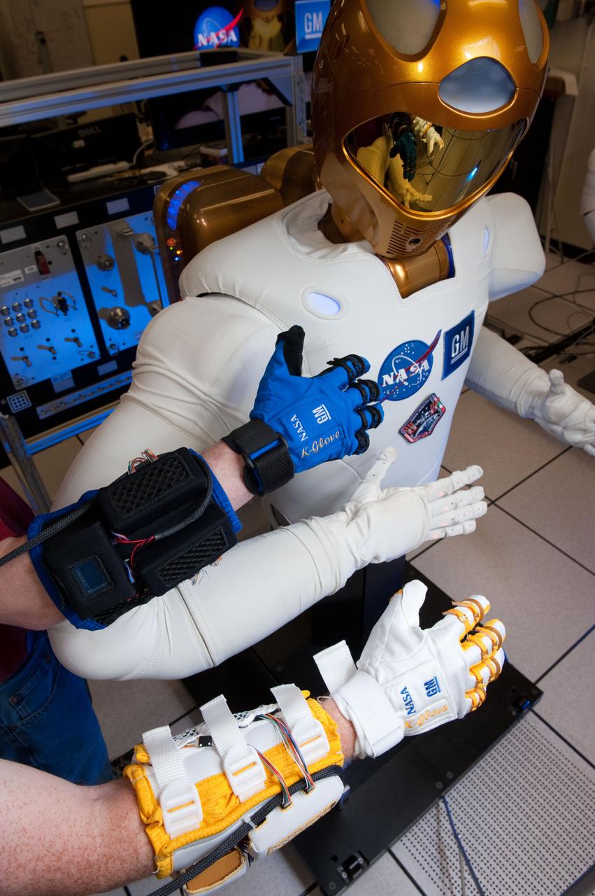 JSC2012-E-034637 (13 March 2012) ---The new Human Grasp Assist device, or Robo-Glove, was built through the continuing partnership between NASA and General Motors. It uses Robonaut 2 technology to increase the strength of a human?s grasp. Photo credit: NASA