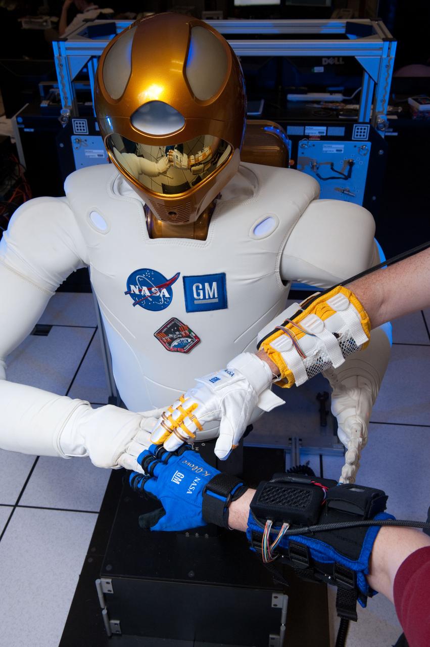 JSC2012-E-034639 (13 March 2012) ---The new Human Grasp Assist device, or Robo-Glove, was built through the continuing partnership between NASA and General Motors. It uses Robonaut 2 technology to increase the strength of a human?s grasp. Photo credit: NASA