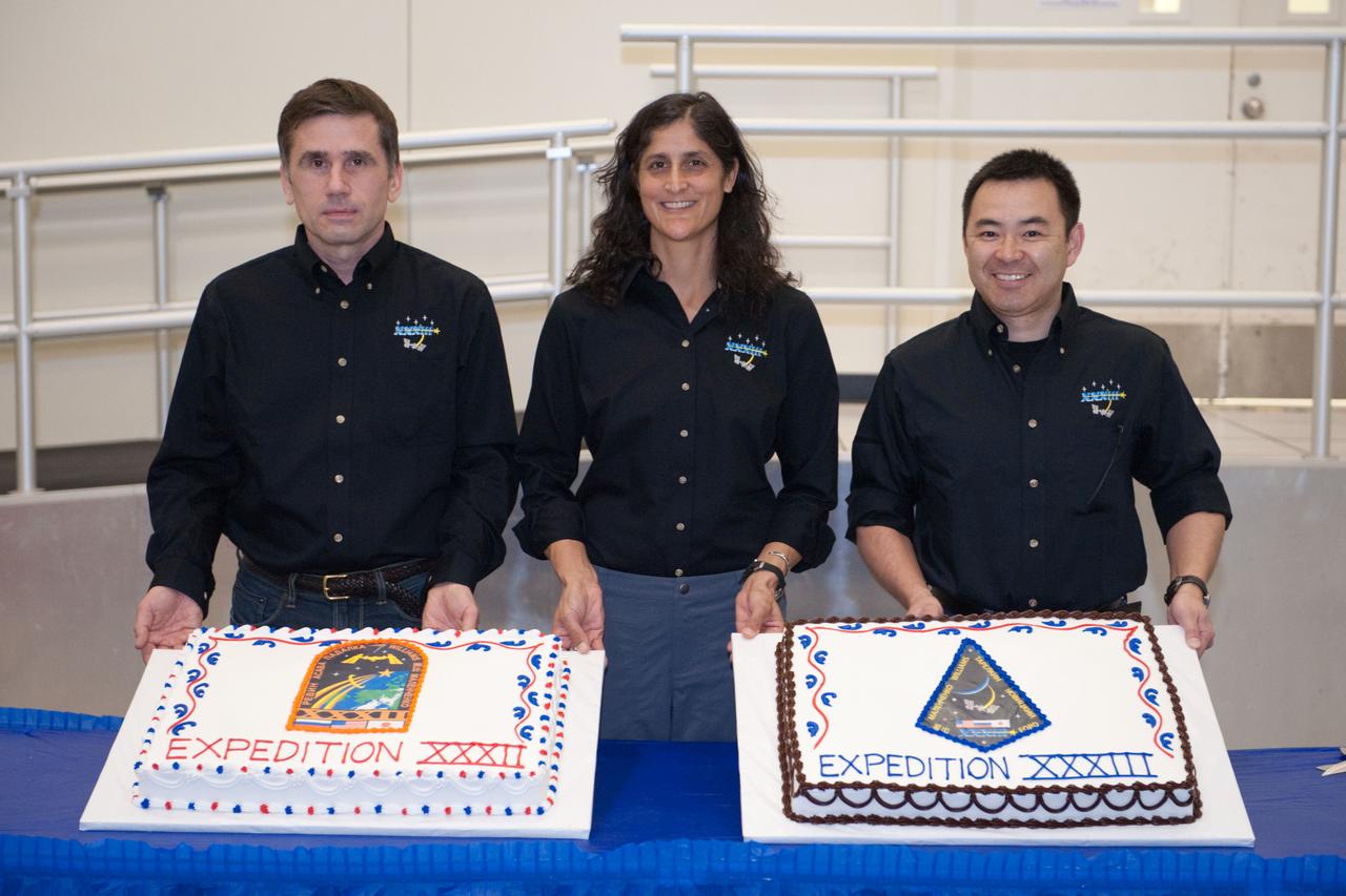 PHOTO DATE: 16 March 2012 LOCATION: Bldg. 5 - High Bay SUBJECT: Soyuz 31/Expedition 33 crew during end of training cake cutting ceremony. PHOTOGRAPHER: Mark Sowa