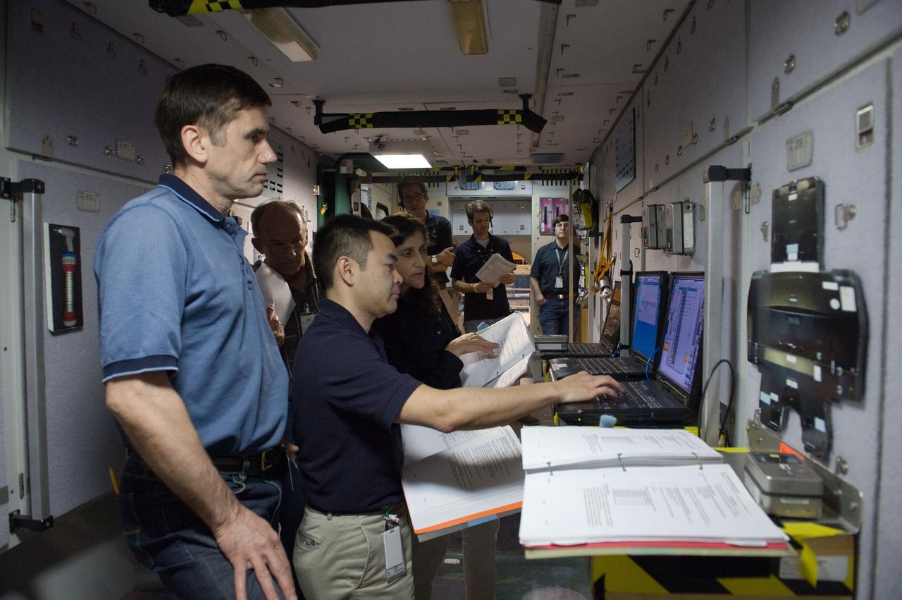 PHOTO DATE:  03/14/12 LOCATION:   B9 ISS MOCKUPS SUBJECT: Expedition 32 (Soyuz 31) crew members Aki Hoshide, Sunita Williams and Yuri Malenchenko during Emergency Scene ASIGND3 training.   PHOTOGRAPHER:GEESEMAN