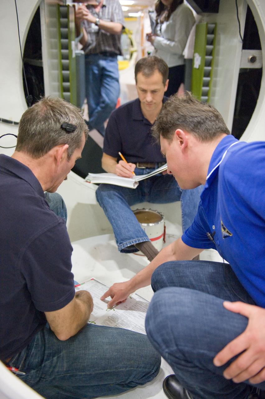 DATE: 3-22-12 LOCATION: Bldg. 9NW - ISS Mockups SUBJECT: Expedition 34 crew Chris Hadfield, Roman Romanenko and Tom Marshburn during emergency scenarios training in the ISS mockups with instructor Kathryn Bolt PHOTOGRAPHER: Lauren Harnett