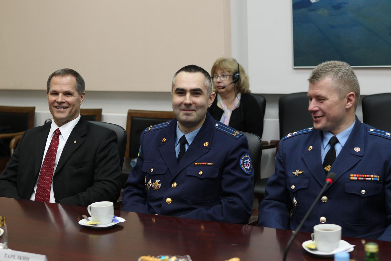 (26 April 2012) -- At the headquarters of the Russian Federal Space Agency, Expedition 31 backup crewmembers Kevin Ford of NASA (left), and Russian cosmonauts Evgeny Tarelkin and Oleg Novitskiy, field questions from Roscosmos officials April 26, 2012 prior to their departure May 2 for their launch site in Baikonur, Kazakhstan. Prime crewmembers Gennady Padalka, Sergei Revin and Joe Acaba (not pictured) are scheduled to launch to the International Space Station May 15 in their Soyuz TMA-04M spacecraft. Photo credit: NASA
