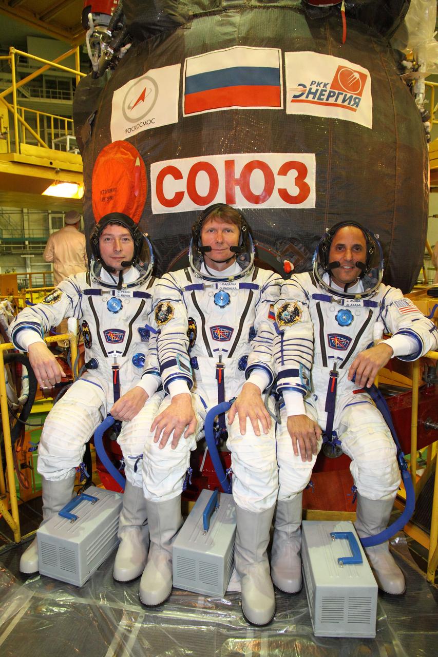 At the Baikonur Cosmodrome in Kazakhstan, the Expedition 31/32 prime crewmembers pose for pictures outside their Soyuz TMA-04M spacecraft during their suited “fit check” dress rehearsal of launch day activities in advance of a May 15 launching to the International Space Station. Seated from left to right in their “Sokol” launch and entry suits are Russian Flight Engineer Sergei Revin, Soyuz Commander Gennady Padalka and NASA Flight Engineer Joe Acaba.   NASA/Victor Zelentsov 