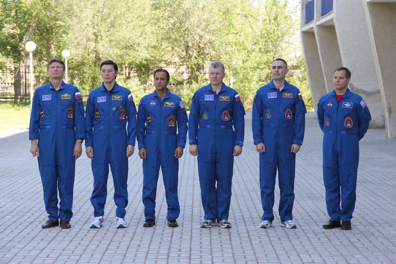 Outside their Cosmonaut Hotel crew quarters in Baikonur, Kazakhstan, the Expedition 31/32 prime and backup crews posed for pictures May 4, 2012 following the traditional raising of Russian, U.S. and Kazakh flags as part of their ceremonial activities leading up to the launch of the Soyuz TMA-04M spacecraft May 15 to the International Space Station. From left to right are prime Soyuz Commander Gennady Padalka, Flight Engineer Sergei Revin and NASA Flight Engineer Joe Acaba and backup crewmembers  Oleg Novitskiy, Evgeny Tarelkin and Kevin Ford of NASA. Padalka, Revin and Acaba will launch to the station for a four-month mission on the orbital outpost.  NASA/Victor Zelentsov 