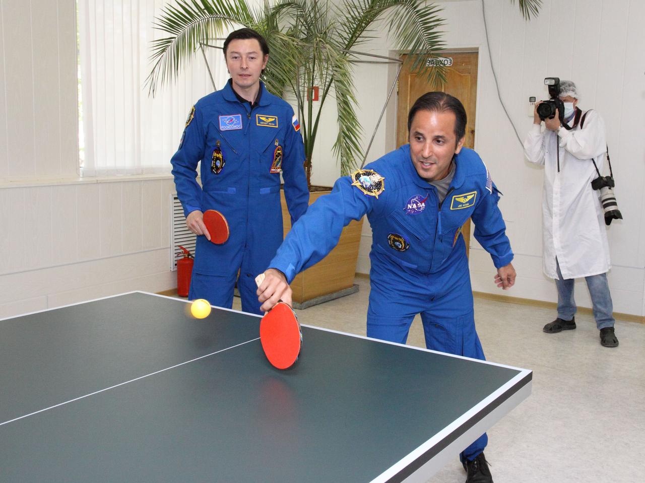 At their Cosmonaut Hotel crew quarters in Baikonur, Kazakhstan, two of the three crewmembers who will next launch to the International Space Station brush up on their ping-pong skills May 10, 2012 as they take a break from final pre-launch training. Expedition 31/32 Flight Engineer Sergei Revin (left) and Flight Engineer Joe Acaba of NASA will join Soyuz Commander Gennady Padalka for launch May 15 on the Soyuz TMA-04M spacecraft from the Baikonur Cosmodrome to begin a four-month mission on the orbital outpost.  NASA/Victor Zelentsov 