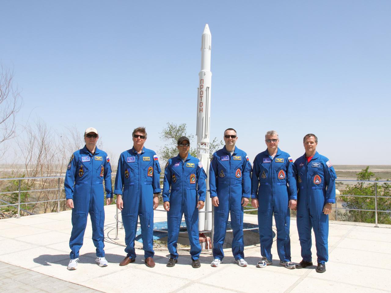Behind the Cosmonaut Hotel crew quarters in Baikonur, Kazakhstan, the prime and backup crewmembers for the Expedition 31/32 increments on the International Space Station pose for pictures May 10, 2012 during a break from training for the upcoming launch of the Soyuz TMA-04M spacecraft to the orbital complex. From left to right are prime Flight Engineer Sergei Revin, prime Soyuz Commander Gennady Padalka, prime Flight Engineer Joe Acaba of NASA, backup Flight Engineer Evgeny Tarelkin, backup Soyuz Commander Oleg Novitskiy and backup Flight Engineer Kevin Ford of NASA. Acaba, Padalka and Revin will launch on May 15 from Baikonur to begin a four-month mission on the station.  NASA/Victor Zelentsov 