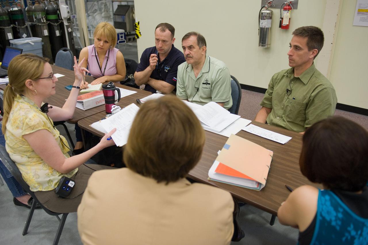 DATE: 5-8-12 LOCATION: Bldg. NW - ISS Mockups SUBJECT: Expedition 35/36 crew training (Pavel Vinogradov, Alexander Misurkin and Chris Cassidy) during emergency scenarios training in the ISS mockups with Station Training Lead, Lucia McCullough. PHOTOGRAPHER: Lauren Harnett 