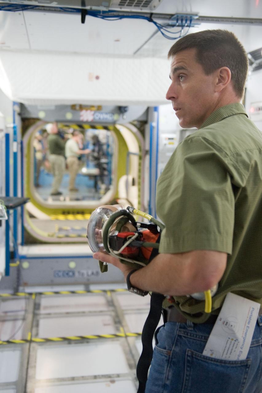 DATE: 5-8-12 LOCATION: Bldg. NW - ISS Mockups SUBJECT: Expedition 35/36 crew training (Pavel Vinogradov, Alexander Misurkin and Chris Cassidy) during emergency scenarios training in the ISS mockups with Station Training Lead, Lucia McCullough. PHOTOGRAPHER: Lauren Harnett 