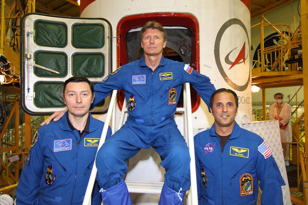At the Baikonur Cosmodrome in Kazakhstan, the next trio of crewmembers bound for the International Space Station pose in front of the hatchway to their Soyuz TMA-04M spacecraft May 11, 2012 as they completed their final “fit check” inspection of the vehicle in its assembly building prior to launch. Expedition 31/32 Flight Engineer Sergei Revin (left), Soyuz Commander Gennady Padalka (center) and NASA Flight Engineer Joe Acaba (right) will liftoff from Baikonur May 15 to begin a four-month mission on the orbital complex.  NASA/Victor Zelentsov 
