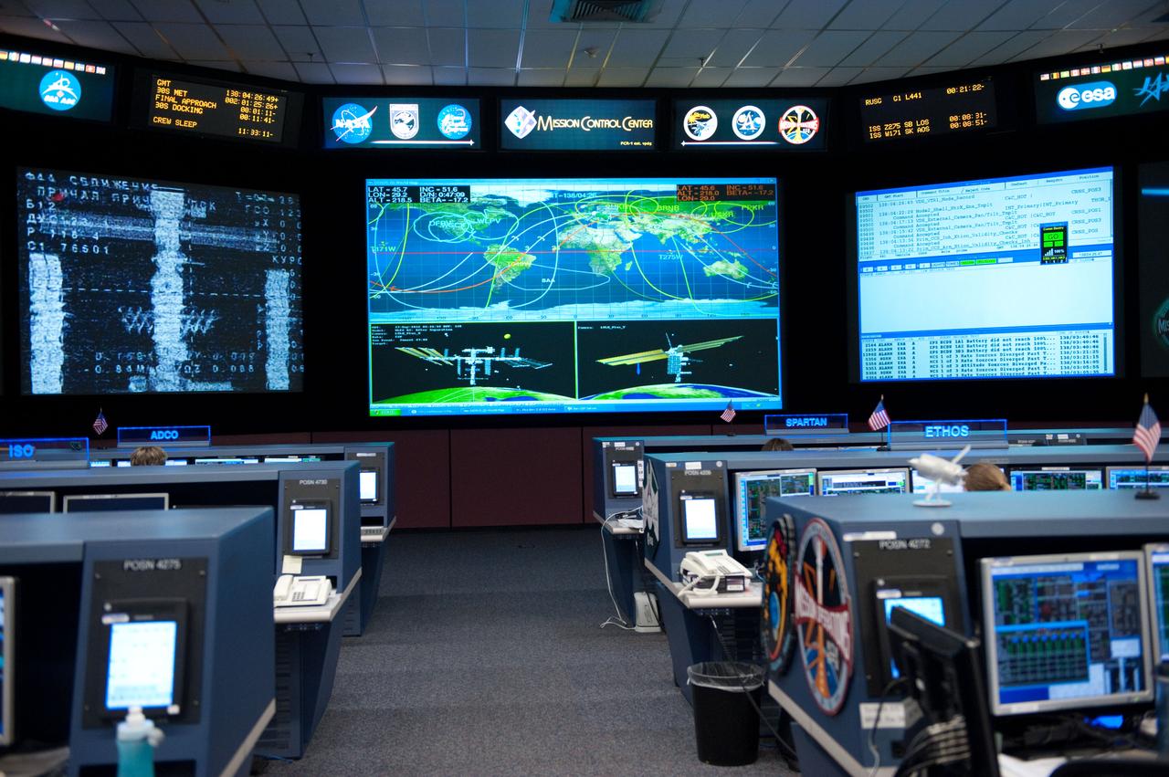 Flight controllers and Flight Director Chris Edelen in the FCR-1 during NASA astronaut Joseph Acaba, flight engineer, and his two Russian crewmates, Soyuz Commander Gennady Padalka and Flight Engineer Sergei Revin, on board the Soyuz TMA-04M spacecraft docking to the space station's Rassvet module at 11:38 p.m.  Photo Date: May 16, 2012.  Location: Building 30 - FCR1.  Photographer: Robert Markowitz