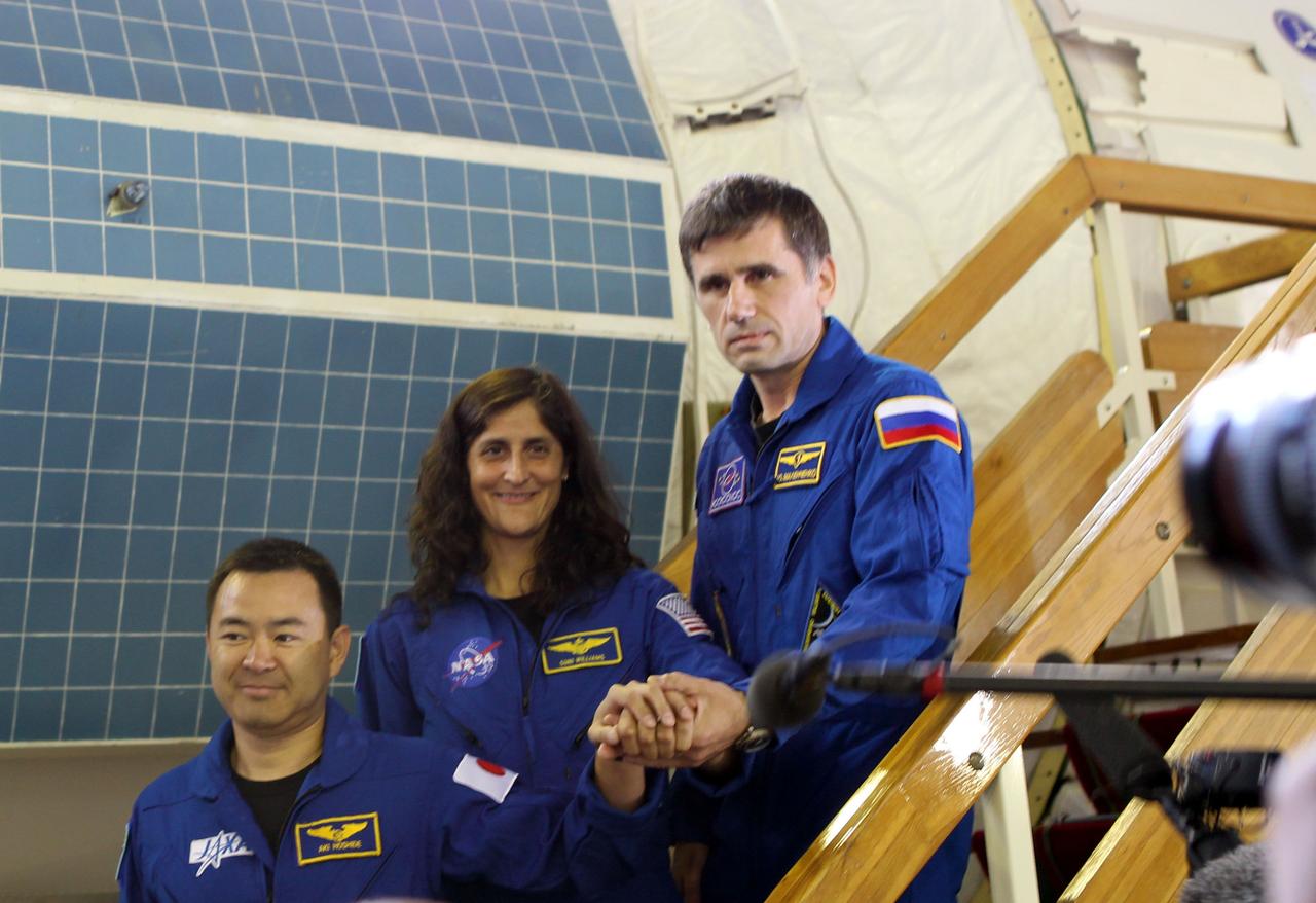 (19 June 2012) --- Expedition 32/33 Japan Aerospace Exploration Agency Flight Engineer Aki Hoshide (left), NASA Flight Engineer Suni Williams (center) and Soyuz Commander Yuri Malenchenko posed for photos prior to their final Russian Segment qualification test June 19, 2012 at the Gagarin Cosmonaut Training Center in Star City, Russia. Malenchenko, Williams and Hoshide are set to launch July 15 from the Baikonur Cosmodrome in their Soyuz TMA-05M spacecraft to the International Space Station.  Photo credit: NASA 