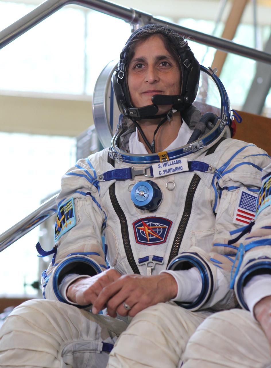 (20 June 2012) --- Expedition 32/33 NASA Flight Engineer Sunita Williams answers questions from the media at a Soyuz vehicle mock-up before a final qualification test June 20, 2012 at the Gagarin Cosmonaut Training Center in Star City, Russia. Williams, along with Soyuz Commander Yuri Malenchenko and Japan Aerospace Exploration Agency Flight Engineer Aki Hoshide (not shown), are scheduled to launch July 15 from the Baikonur Cosmodrome in their Soyuz TMA-05M spacecraft to the International Space Station. Photo credit: NASA/Stephanie Stoll