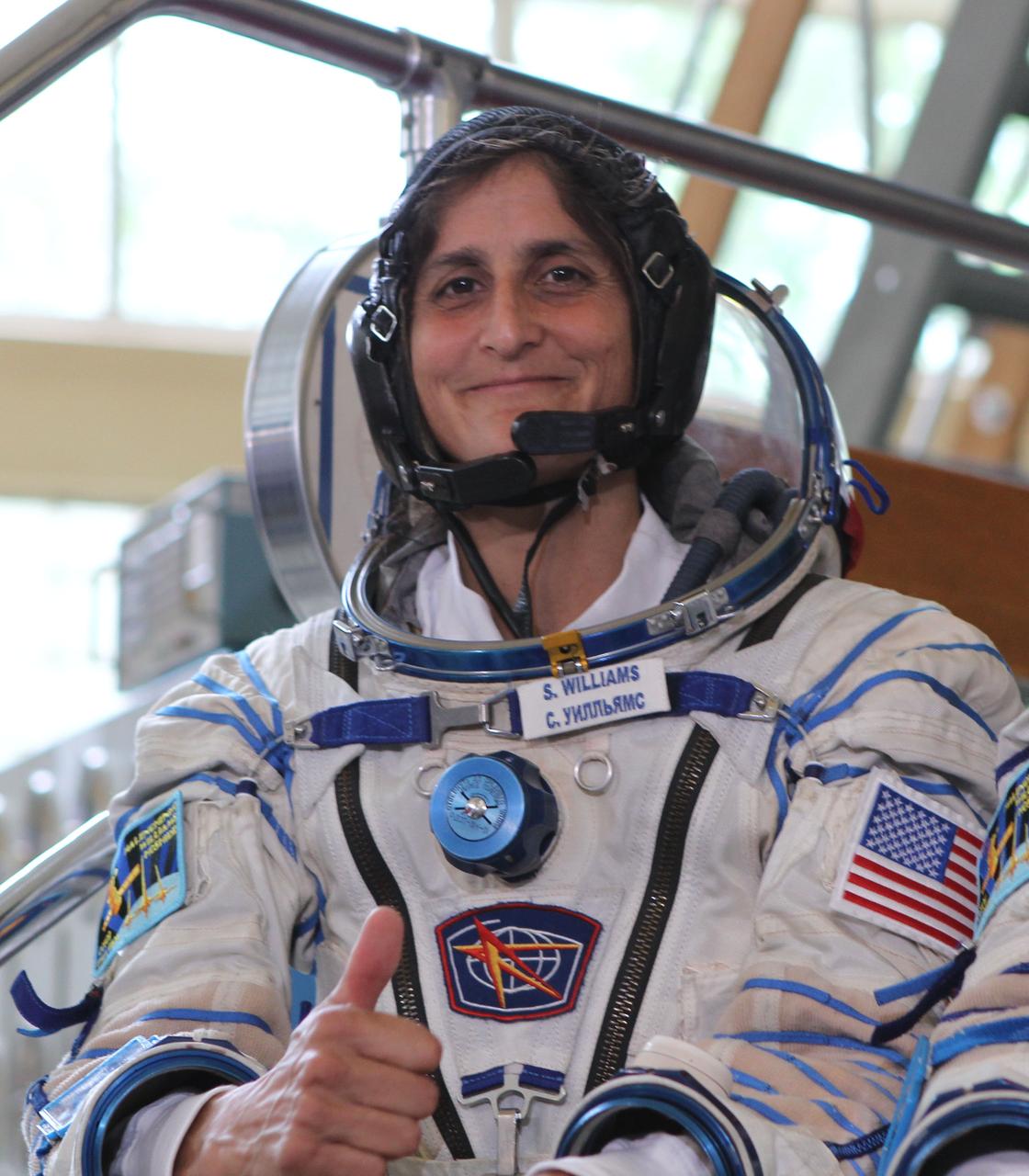 (20 June 2012) --- Expedition 32/33 NASA Flight Engineer Sunita Williams of NASA gives a thumbs up during a media session at a Soyuz vehicle mock-up before a final qualification test June 20, 2012 at the Gagarin Cosmonaut Training Center in Star City, Russia. Williams, along with Soyuz Commander Yuri Malenchenko and Japan Aerospace Exploration Agency Flight Engineer Aki Hoshide are scheduled to launch July 15 from the Baikonur Cosmodrome in their Soyuz TMA-05M spacecraft to the International Space Station. Photo credit: NASA/Stephanie Stoll