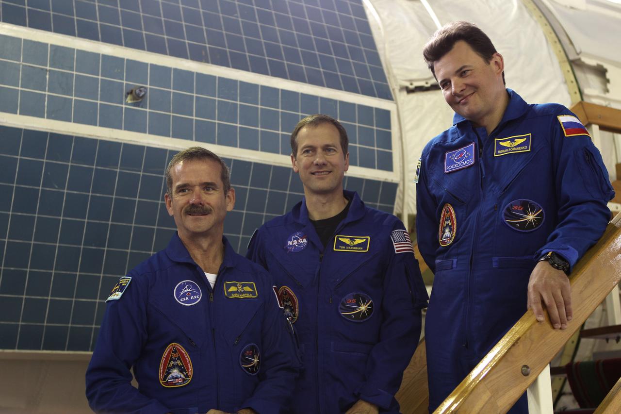 At the Gagarin Cosmonaut Training Center in Star City, Russia, the Expedition 32/33 backup crew posed for pictures June 20, 2012 as they participated in the second of two days of Soyuz spacecraft qualification exams. Backup Flight Engineer Chris Hadfield of the Canadian Space Agency (left), backup Flight Engineer Tom Marshburn of NASA (center) and backup Soyuz Commander Roman Romanenko are understudies to the prime crew, NASA Flight Sunita Williams, Aki Hoshide of the Japan Aerospace Exploration Agency and Yuri Malenchenko, who will launch July 15 to the International Space Station in their Soyuz TMA-05M spacecraft from the Baikonur Cosmodrome in Kazakhstan.  Credit: NASA/Stephanie Stoll 
