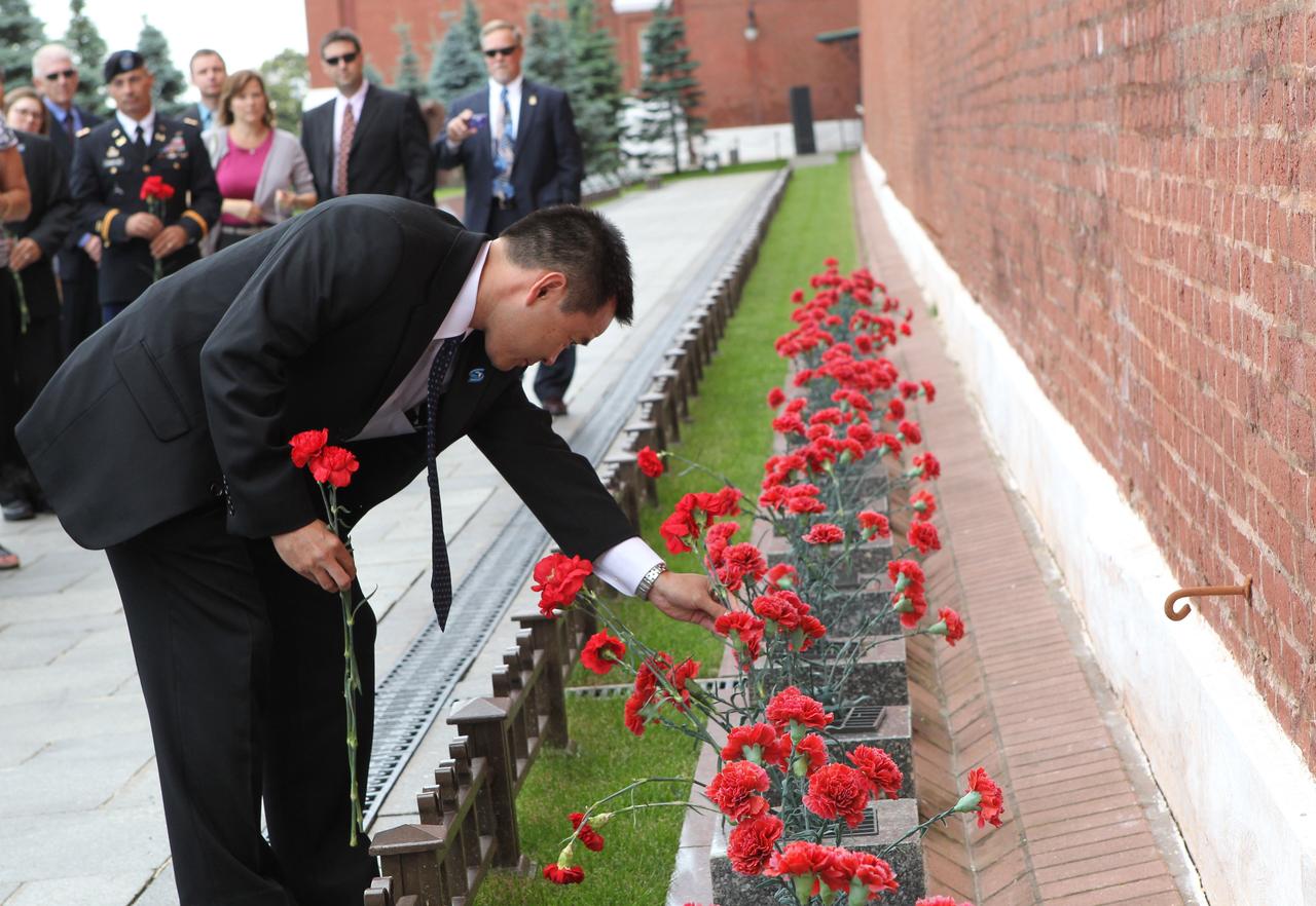 At the Kremlin Wall at Red Square in Moscow where Russian space icons are interred, Expedition 32/33 Flight Engineer Aki Hoshide of the Japan Aerospace Exploration Agency laid flowers June 22, 2012 as part of the traditional ceremonies prior to launch July 15 to the International Space Station. Hoshide, along with NASA Flight Engineer Sunita Williams and Soyuz Commander Yuri Malenchenko will fly to the Baikonur Cosmodrome in Kazakhstan July 2 for final preparations for their launch in the Soyuz TMA-05M spacecraft.  Credit: NASA/Stephanie Stoll 