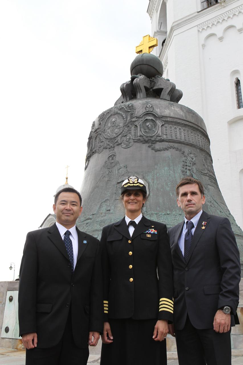 Expedition 32/33 Flight Engineer Aki Hoshide of the Japan Aerospace Exploration Agency (left), NASA Flight Engineer Sunita Williams (center) and Soyuz Commander Yuri Malenchenko (right) posed for pictures in front of the Tsar Bell at the Kremlin in Moscow June 22, 2012 as part of their traditional pre-flight ceremonial activities. The trio will fly to the Baikonur Cosmodrome in Kazakhstan July 2 for final preparations for their launch July 15 to the International Space Station in their Soyuz TMA-05M spacecraft.  Credit: NASA/Stephanie Stoll 