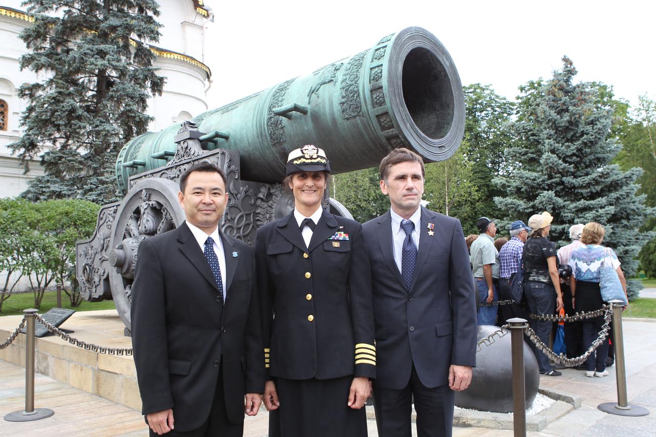 Expedition 32/33 Flight Engineer Aki Hoshide of the Japan Aerospace Exploration Agency (left), NASA Flight Engineer Sunita Williams (center) and Soyuz Commander Yuri Malenchenko (right) posed for pictures in front of the Tsar Cannon at the Kremlin in Moscow June 22, 2012 as part of their traditional pre-flight ceremonial activities. The trio will fly to the Baikonur Cosmodrome in Kazakhstan July 2 for final preparations for their launch July 15 to the International Space Station in their Soyuz TMA-05M spacecraft.  Credit: NASA/Stephanie Stoll 