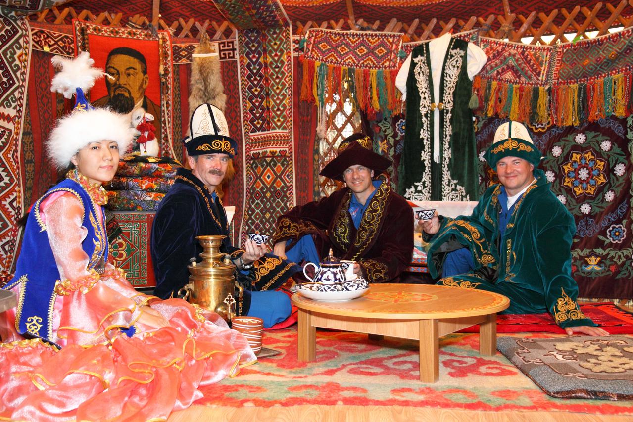 In Baikonur, Kazakhstan, the backup Expedition 32/33 crewmembers are treated to a traditional Kazakh meal in ceremonial garb in a “yurt” or native hut July 7, 2012 as part of the pre-launch ceremonies that will lead to the launch of the prime crew --- NASA’s Sunita Williams, Yuri Malenchenko and Aki Hoshide of the Japan Aerospace Exploration Agency --- to the International Space Station July 15 in their Soyuz TMA-05M spacecraft.  Enjoying a free afternoon in Baikonur were backup Flight Engineer Chris Hadfield of the Canadian Space Agency (second from the left), NASA’s Tom Marshburn (second from the right) and Russian Soyuz Commander Roman Romanenko (far right).  NASA/Victor Zelentsov 