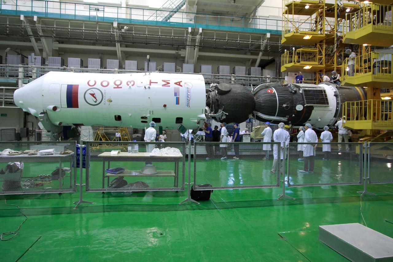 At the Baikonur Cosmodrome in Kazakhstan, the Soyuz TMA-05M spacecraft (right) is readied for its encapsulation into the upper stage of its Soyuz booster (left) July 8, 2012 in advance of its rollout to the launch pad July 12 and the launch of its occupants, Expedition 32/33 Soyuz Commander Yuri Malenchenko, NASA Flight Engineer Sunita Williams and Flight Engineer Aki Hoshide of the Japan Aerospace Exploration Agency July 15 for a four-month mission on the International Space Station.  NASA/Victor Zelentsov 