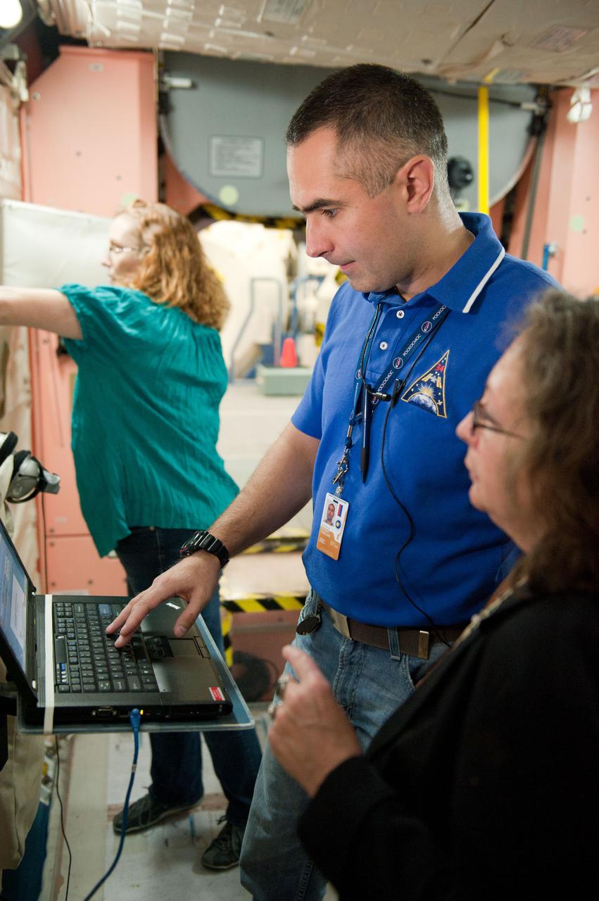 PHOTO DATE: 7-20-12 LOCATION: Bldg. 9NW - ISS Mockups SUBJECT: Expedition 34 (Soyuz 32) crew (Ford, Tarelkin and Notivskiy) during routine ops training in the ISS mockups PHOTOGRAPHER: Lauren Harnett