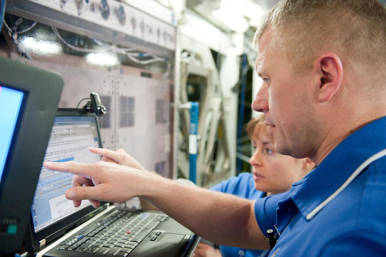 PHOTO DATE: 7-20-12 LOCATION: Bldg. 9NW - ISS Mockups SUBJECT: Expedition 34 (Soyuz 32) crew (Ford, Tarelkin and Notivskiy) during routine ops training in the ISS mockups PHOTOGRAPHER: Lauren Harnett