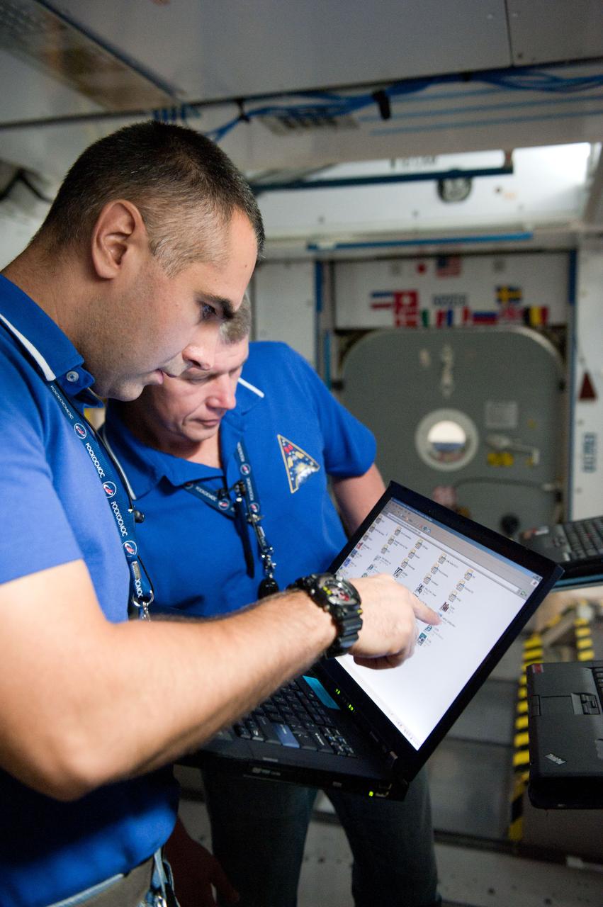 PHOTO DATE: 7-20-12 LOCATION: Bldg. 9NW - ISS Mockups SUBJECT: Expedition 34 (Soyuz 32) crew (Ford, Tarelkin and Notivskiy) during routine ops training in the ISS mockups PHOTOGRAPHER: Lauren Harnett