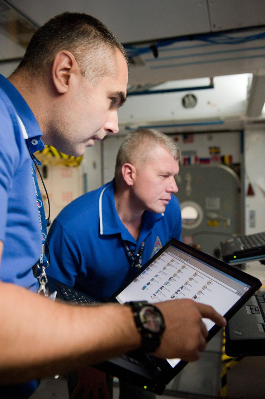 PHOTO DATE: 7-20-12 LOCATION: Bldg. 9NW - ISS Mockups SUBJECT: Expedition 34 (Soyuz 32) crew (Ford, Tarelkin and Notivskiy) during routine ops training in the ISS mockups PHOTOGRAPHER: Lauren Harnett