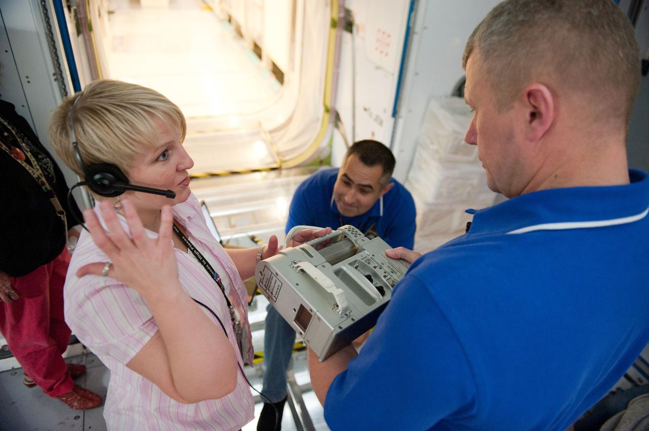 PHOTO DATE: 7-20-12 LOCATION: Bldg. 9NW - ISS Mockups SUBJECT: Expedition 34 (Soyuz 32) crew (Ford, Tarelkin and Notivskiy) during routine ops training in the ISS mockups PHOTOGRAPHER: Lauren Harnett