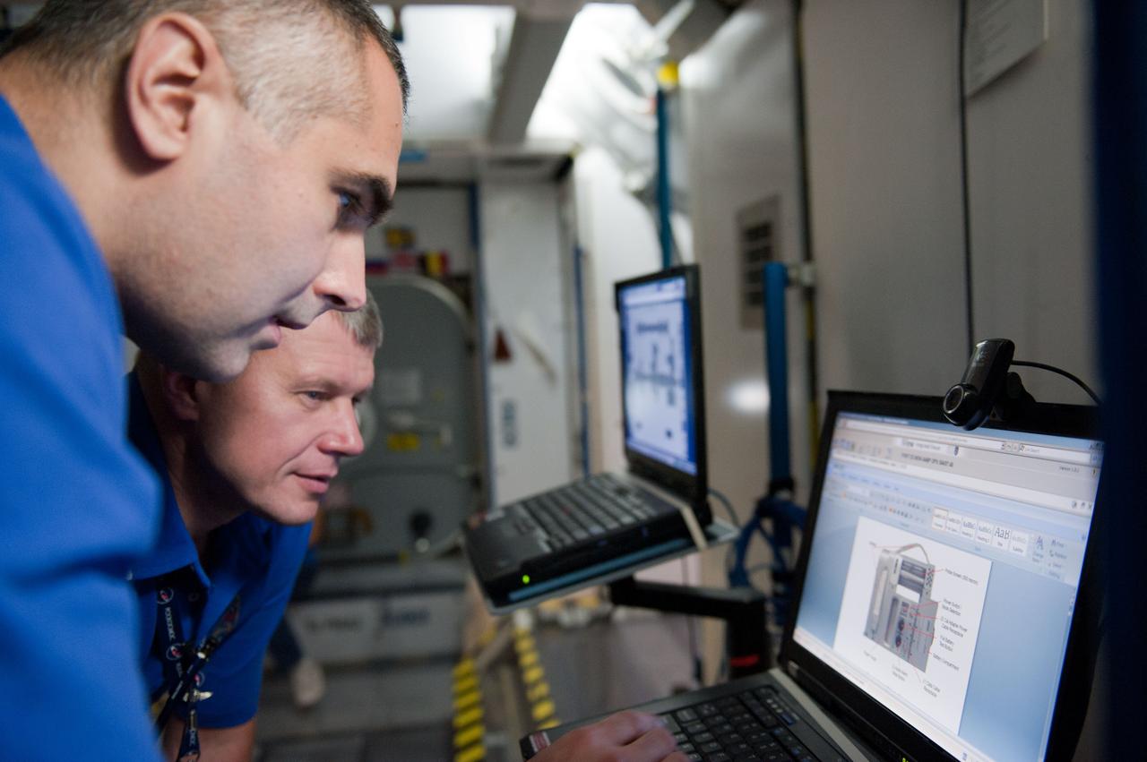 PHOTO DATE: 7-20-12 LOCATION: Bldg. 9NW - ISS Mockups SUBJECT: Expedition 34 (Soyuz 32) crew (Ford, Tarelkin and Notivskiy) during routine ops training in the ISS mockups PHOTOGRAPHER: Lauren Harnett