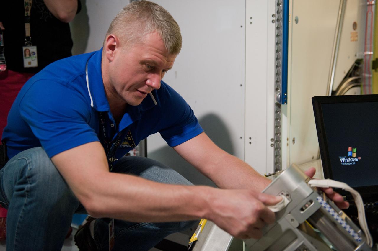 PHOTO DATE: 7-20-12 LOCATION: Bldg. 9NW - ISS Mockups SUBJECT: Expedition 34 (Soyuz 32) crew (Ford, Tarelkin and Notivskiy) during routine ops training in the ISS mockups PHOTOGRAPHER: Lauren Harnett