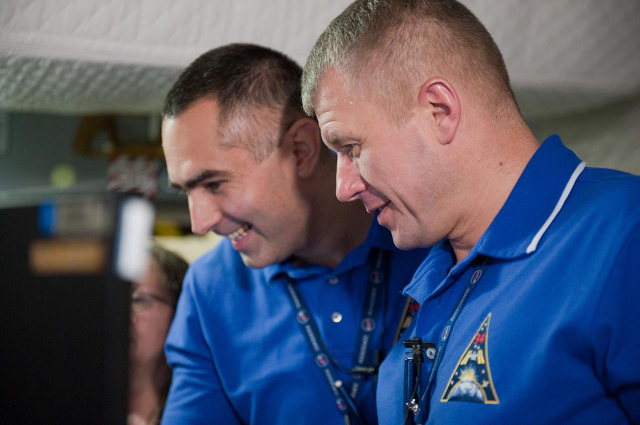 PHOTO DATE: 7-20-12 LOCATION: Bldg. 9NW - ISS Mockups SUBJECT: Expedition 34 (Soyuz 32) crew (Ford, Tarelkin and Notivskiy) during routine ops training in the ISS mockups PHOTOGRAPHER: Lauren Harnett