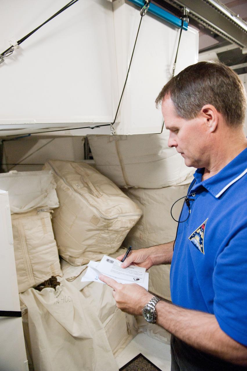 PHOTO DATE: 7-20-12 LOCATION: Bldg. 9NW - ISS Mockups SUBJECT: Expedition 34 (Soyuz 32) crew (Ford, Tarelkin and Notivskiy) during routine ops training in the ISS mockups PHOTOGRAPHER: Lauren Harnett