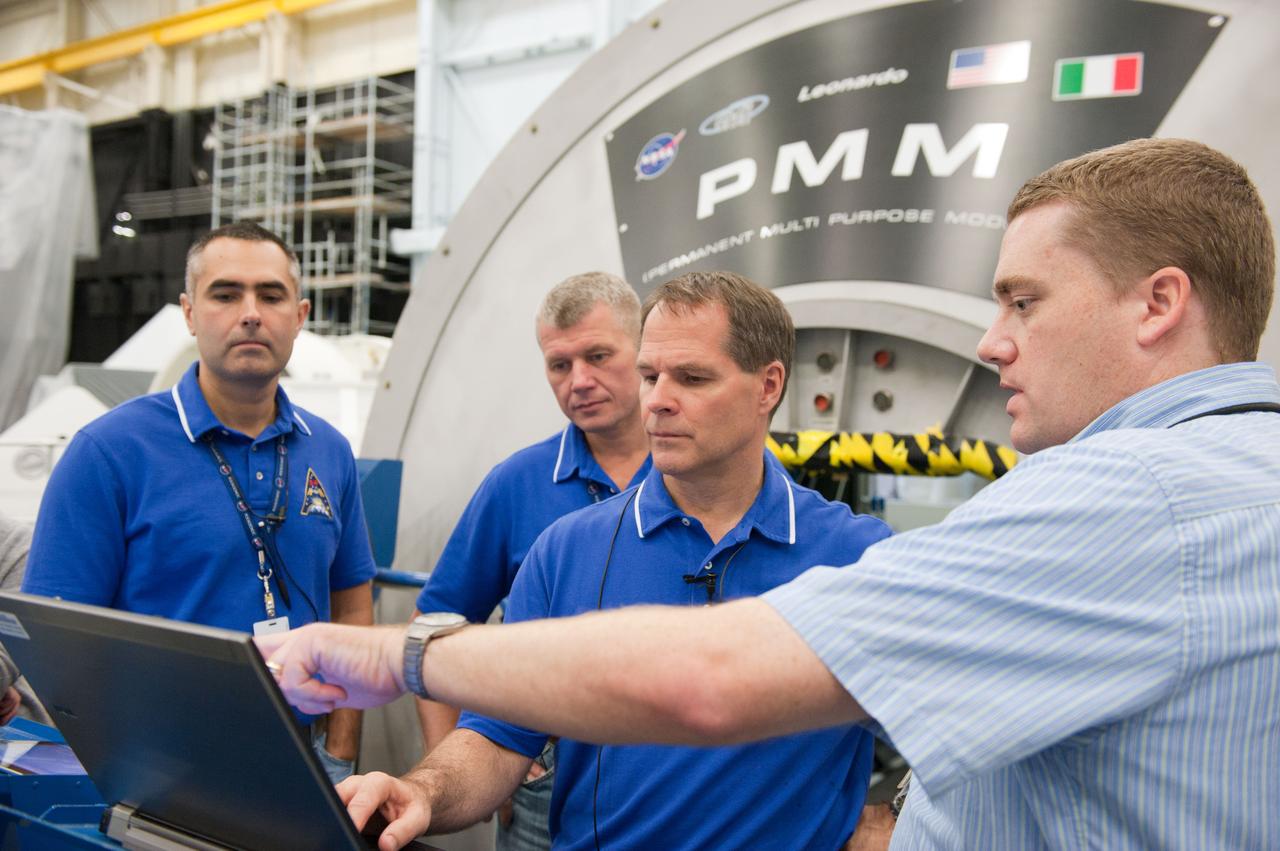 PHOTO DATE: 7-20-12 LOCATION: Bldg. 9NW - ISS Mockups SUBJECT: Expedition 34 (Soyuz 32) crew (Ford, Tarelkin and Notivskiy) during routine ops training in the ISS mockups PHOTOGRAPHER: Lauren Harnett