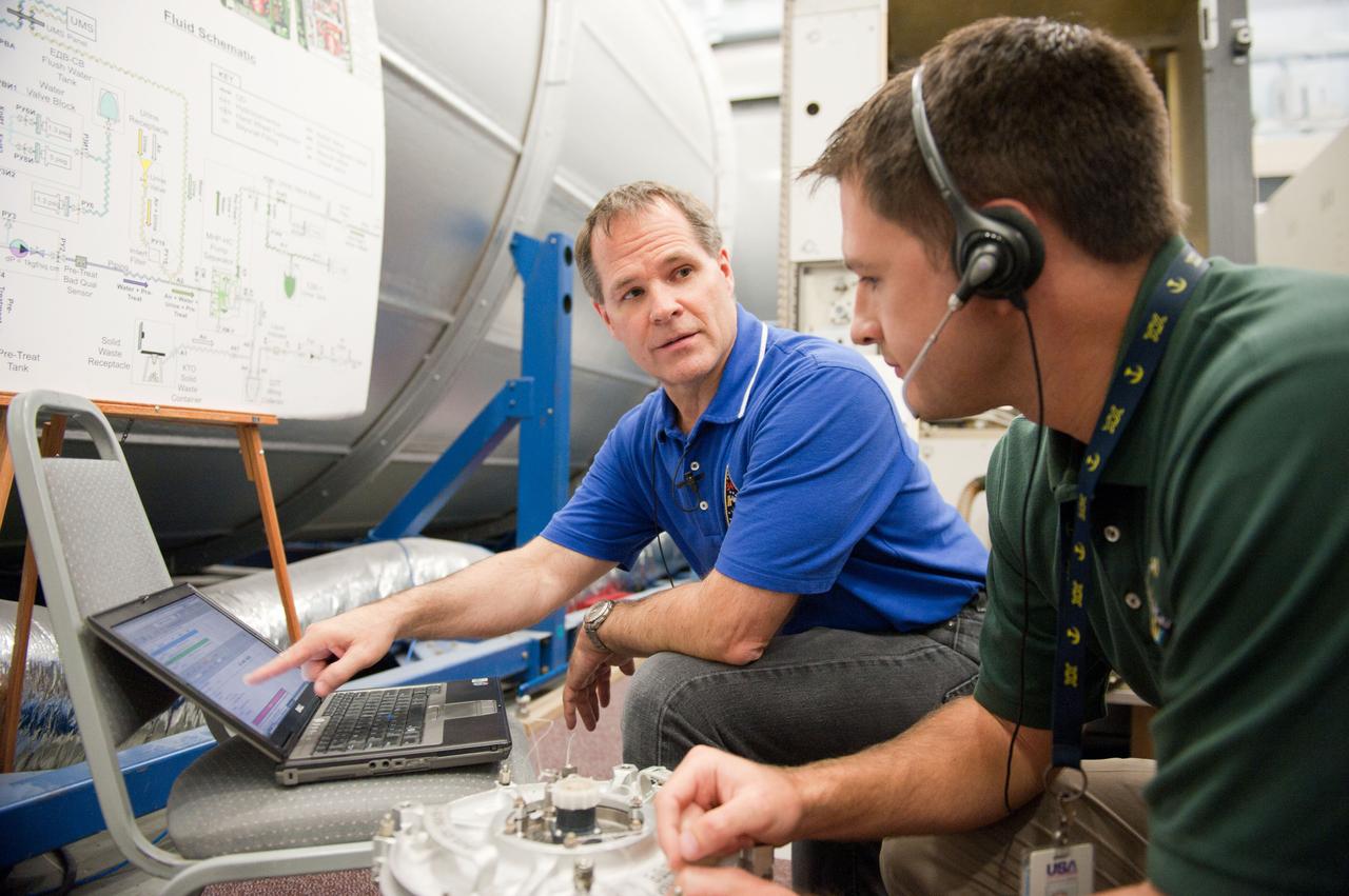 PHOTO DATE: 7-20-12 LOCATION: Bldg. 9NW - ISS Mockups SUBJECT: Expedition 34 (Soyuz 32) crew (Ford, Tarelkin and Notivskiy) during routine ops training in the ISS mockups PHOTOGRAPHER: Lauren Harnett