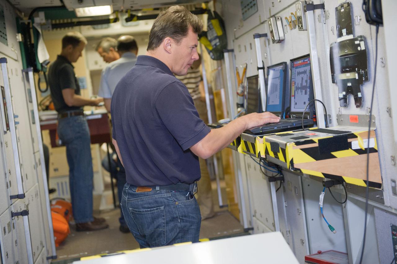 JSC2012-E-108015 (2 Aug. 2012) --- Russian cosmonaut Roman Romanenko, Expedition 34/35 flight engineer, uses a computer during an emergency scenario training session in an International Space Station mock-up/trainer in the Space Vehicle Mock-up Facility at NASA's Johnson Space Center. Photo credit: NASA