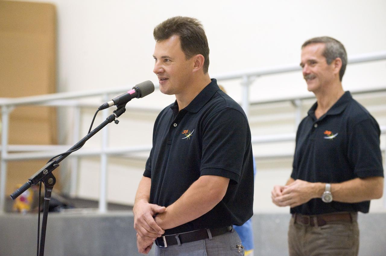 PHOTO DATE: 09-12-12 LOCATION: Bldg. 5 - SSTF High Bay SUBJECT: Expedition 34/35 (Soyuz 33) crew during the SSTF Cake Ceremony PHOTOGRAPHER: BILL STAFFORD