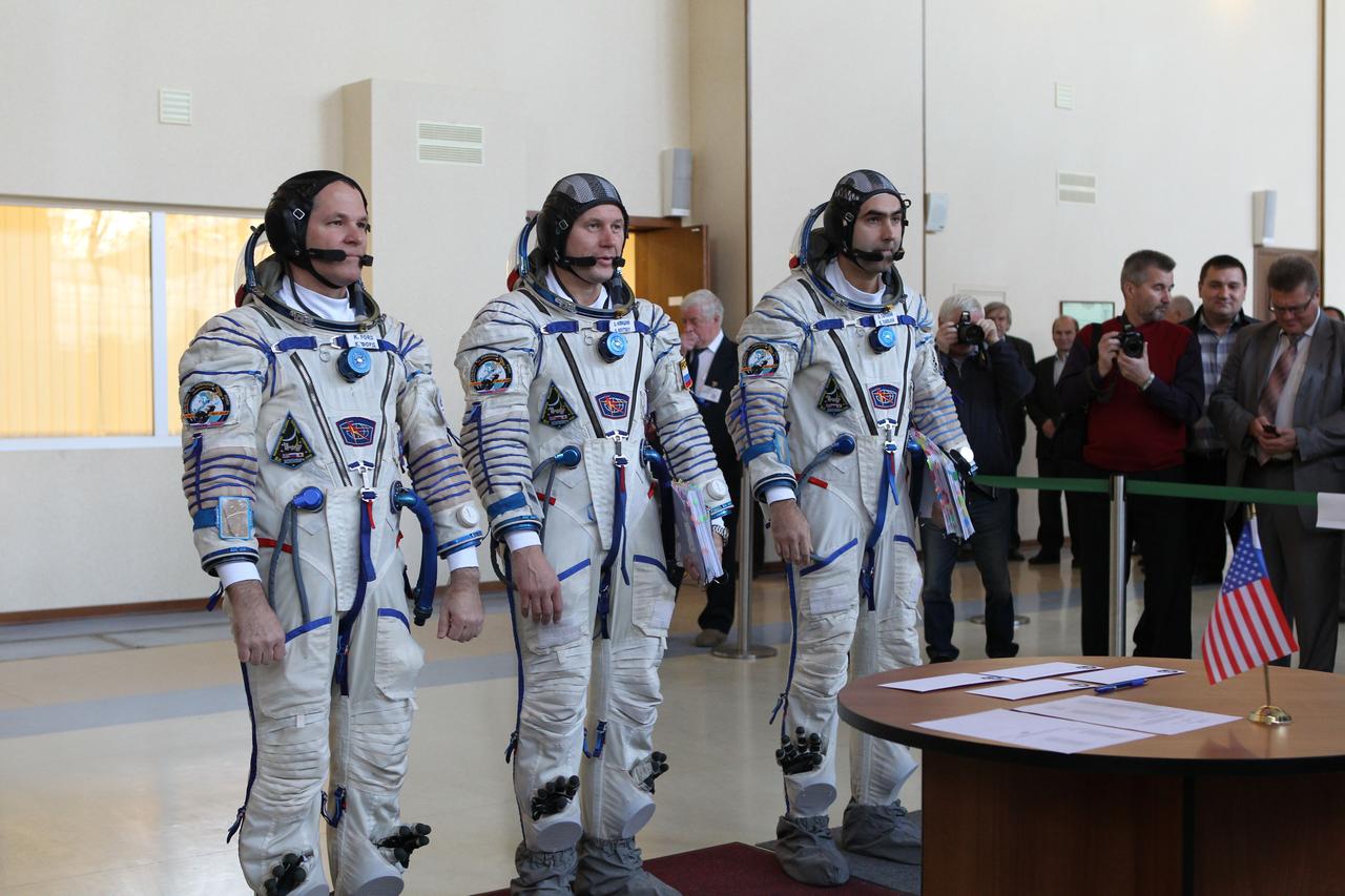 At the Gagarin Cosmonaut Training Center in Star City, Russia, Expedition 33/34 prime crewmembers Flight Engineer Kevin Ford of NASA (left), Soyuz Commander Oleg Novitskiy (center) and Flight Engineer Evgeny Tarelkin (right) report for their second day of final qualification exams September 21, 2012. The exams will lead to their launch October 23 in the Soyuz TMA-06M spacecraft from the Baikonur Cosmodrome in Kazakhstan for a five-month stay on the International Space Station. Photo Credit: Stephanie Stoll/NASA