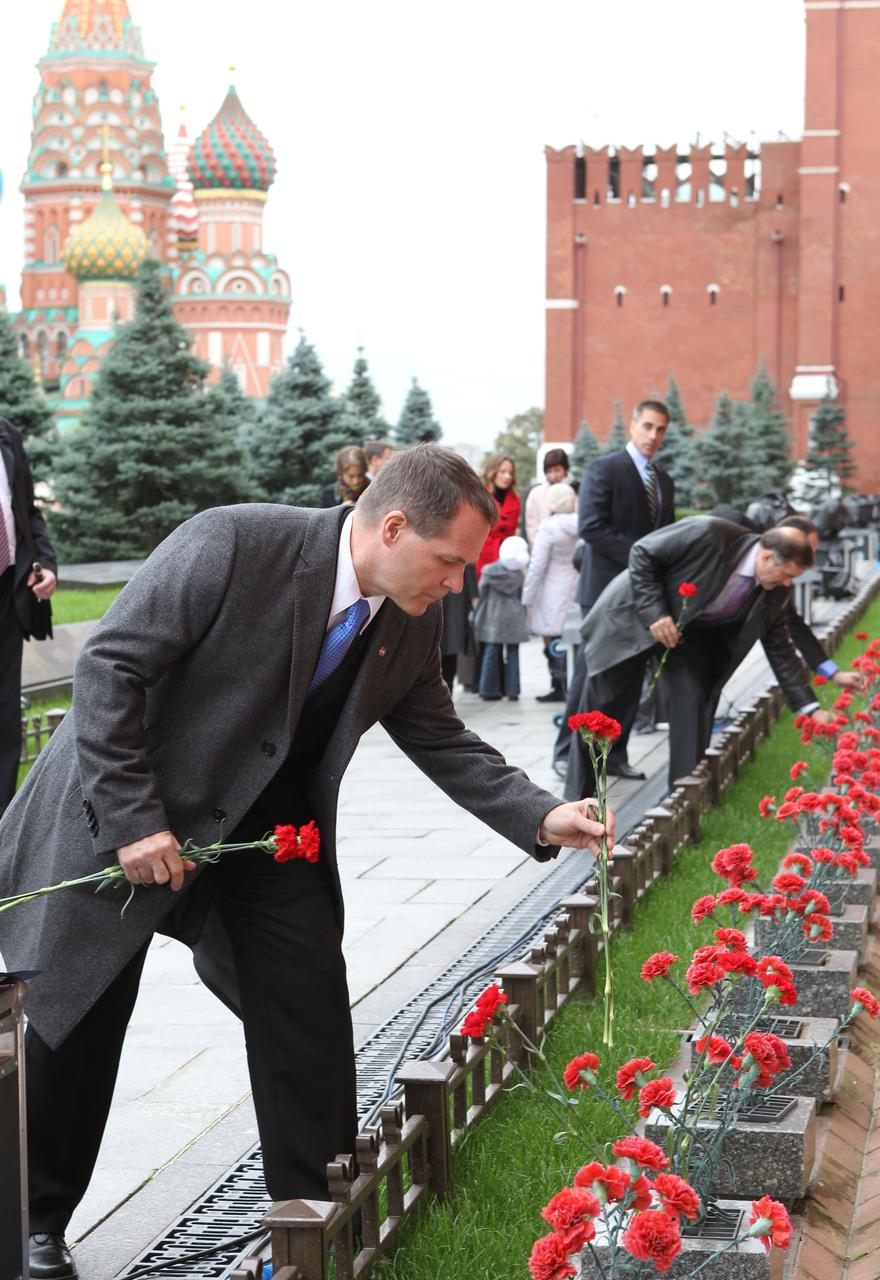 Expedition 33/34 Flight Engineer Kevin Ford of NASA plants a flower at the Kremlin Wall in Moscow where Russian space icons are interred September 25, 2012 as he, Flight Engineer Evgeny Tarelkin and Soyuz Commander Oleg Novitskiy participated in traditional ceremonies leading to their launch to the International Space Station October 23 in the Soyuz TMA-06M spacecraft from the Baikonur Cosmodrome in Kazakhstan for a five-month mission. In the background, the backup crew, Pavel Vinogradov, Chris Cassidy of NASA and Alexander Misurkin also planted flowers at the Wall, where Russian space icons are interred. NASA/Stephanie Stoll