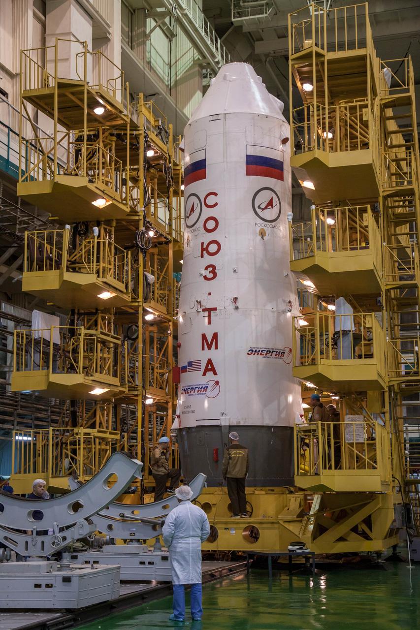 With the Soyuz TMA-06M spacecraft safely installed inside, the upper stage of its Soyuz booster rocket rests in the vertical position in the Integration Facility at the Baikonur Cosmodrome in Kazakhstan October 16, 2012. The Soyuz is being prepared for launch October 23 to the International Space Station with NASA Flight Engineer Kevin Ford, Soyuz Commander Oleg Novitskiy and Flight Engineer Evgeny Tarelkin for a five-month mission on the orbital laboratory. NASA/Victor Zelentsov