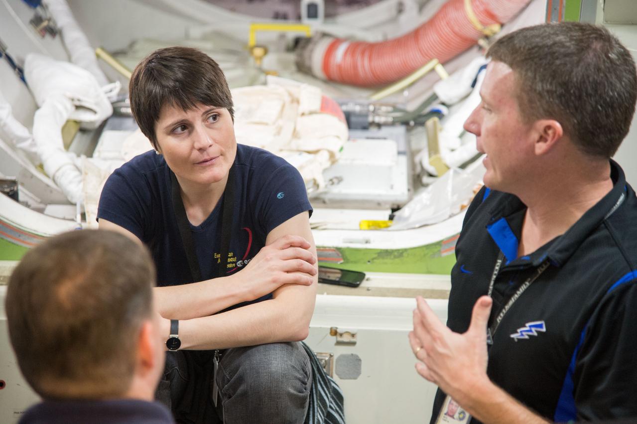 PHOTO DATE:   11-16-12 LOCATION:  Bldg. 9NW - ISS Mockups  SUBJECT: Expedition 41/42 crew members Barry Wilmore, Terry Virts and Italian ESA astronaut Samantha Cristoforetti during ISS Joint AL Hardware training in the ISS mockups. PHOTOGRAPHER: BILL STAFFORD