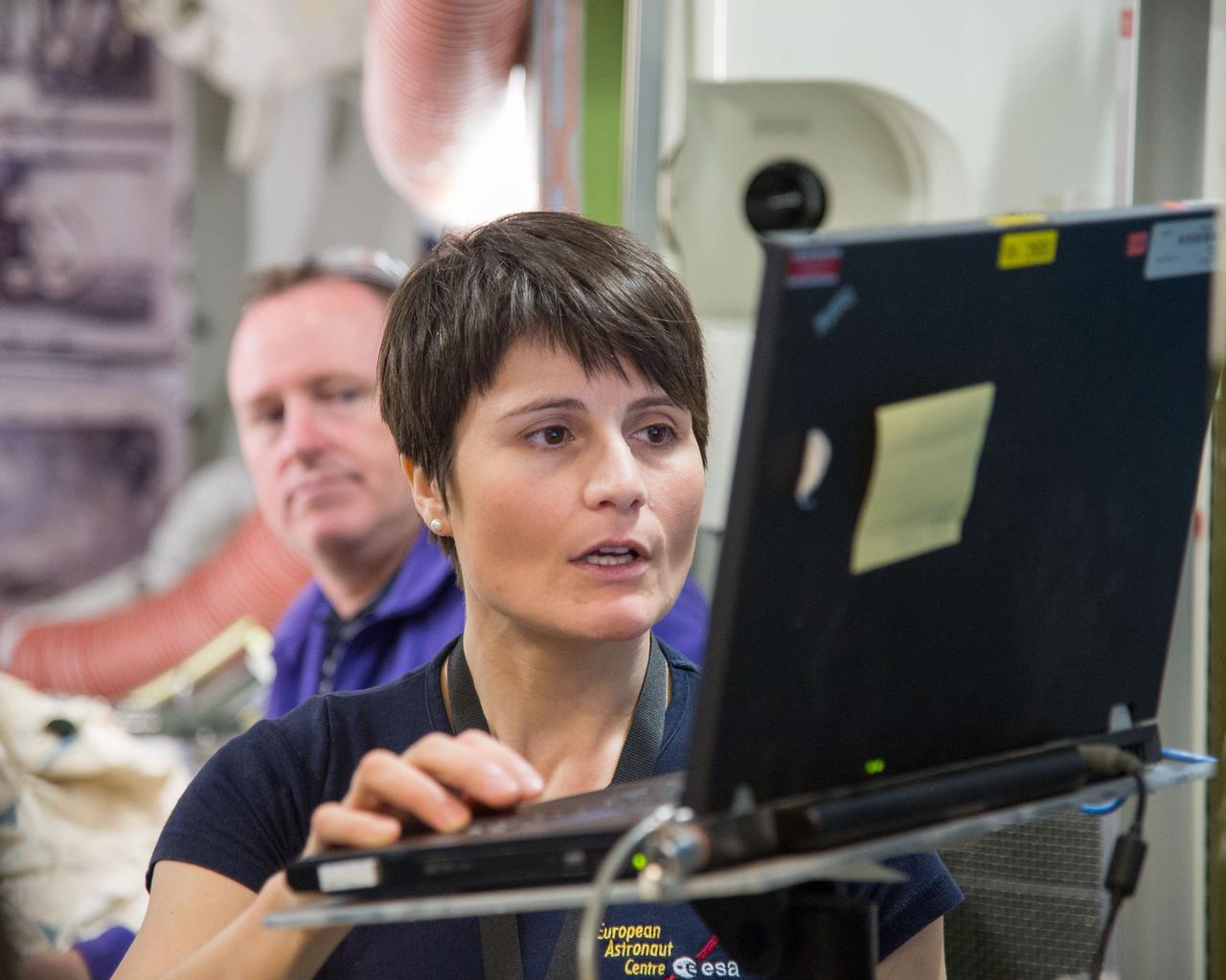 PHOTO DATE:   11-16-12 LOCATION:  Bldg. 9NW - ISS Mockups  SUBJECT: Expedition 41/42 crew members Barry Wilmore, Terry Virts and Italian ESA astronaut Samantha Cristoforetti during ISS Joint AL Hardware training in the ISS mockups. PHOTOGRAPHER: BILL STAFFORD