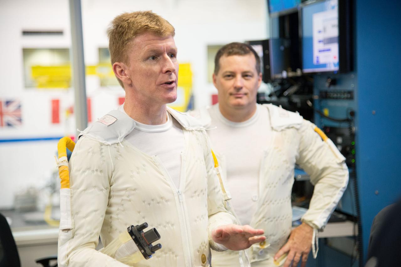 ESA astronaut and first astronaut from the United Kingdom, Timothy Peake, with NASA astronaut Scott Tingle (unassigned) during EVA Skills training in the NBL.  Photo Date: November 27, 2012.  Location: NBL - Pool Topside.  Photographer: Robert Markowitz