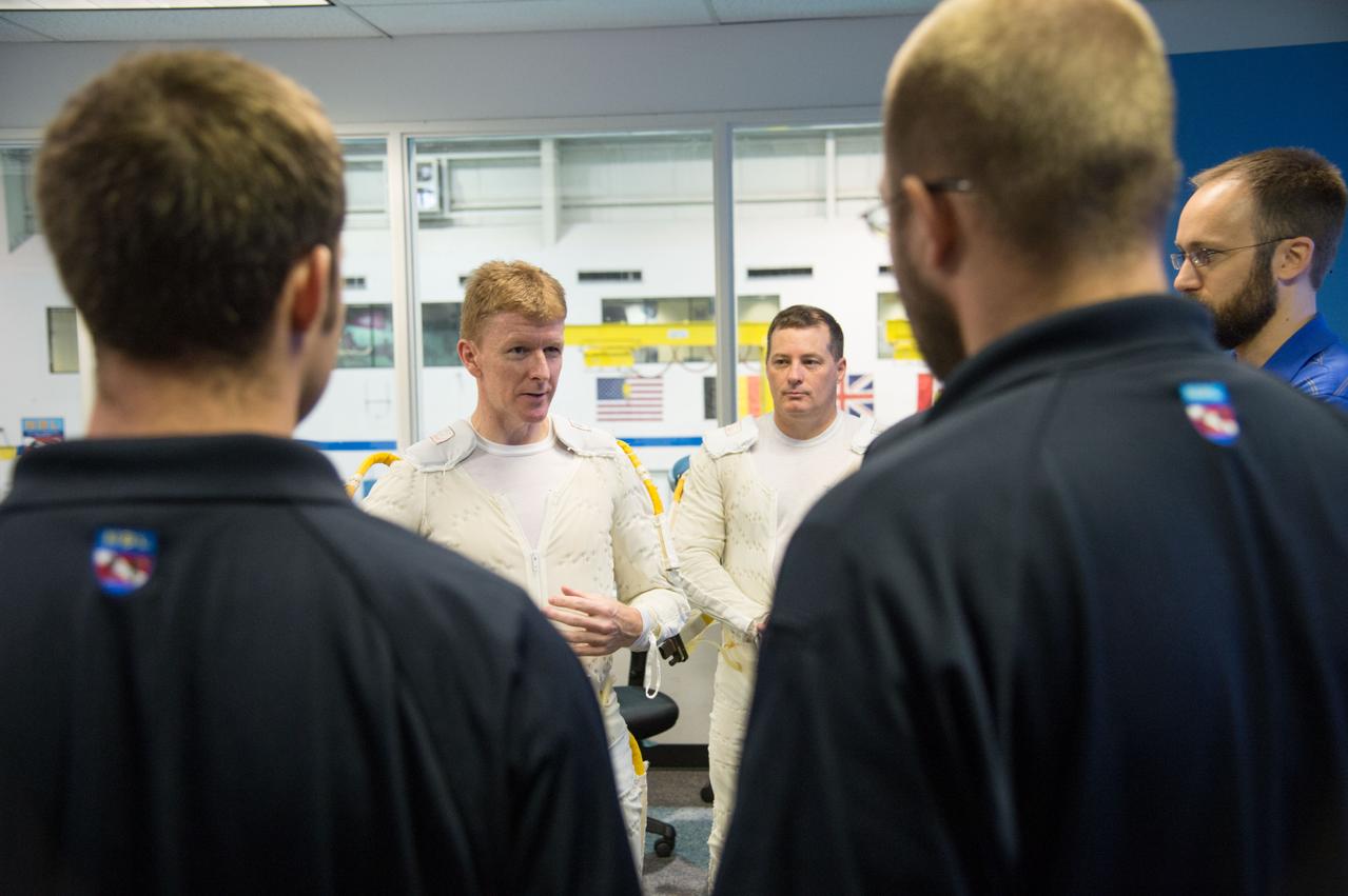 ESA astronaut and first astronaut from the United Kingdom, Timothy Peake, with NASA astronaut Scott Tingle (unassigned) during EVA Skills training in the NBL.  Photo Date: November 27, 2012.  Location: NBL - Pool Topside.  Photographer: Robert Markowitz